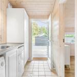 Kitchen with sink, dishwasher, and view of the outdoor area.