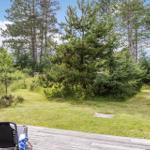 Deck with garden and trees in the background