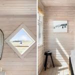 Holzvertäfelte Wand mit Fenster und Spiegel. Schlafzimmer mit Bett und Stuhl.