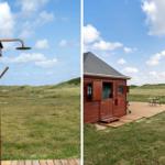 Hütte mit Dusche im Freien und Terrasse mit Flagge.