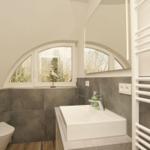 Badezimmer mit Waschbecken, Toilette und Badezimmerfenster