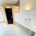Bath with whirlpool and built-in sauna
