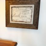 Wall art in rustic wooden frame with French postage motif