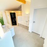 Bathroom with bathtub, shower, and wooden sauna