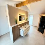 Bathroom with sink, mirror, and sauna