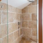Shower with stone walls and shower head