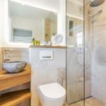 Bathroom with shower, sink, and toilet