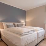 Bedroom with double bed, nightstands, and window