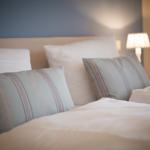 Bed head with pillows and bedside lamp