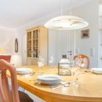 Dining table with chairs and dishes in dining room