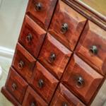 Wooden cabinet with nine drawers and metal handles