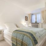 Bedroom with bed, nightstand, and window
