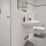 Bathroom with shower, sink and toilet