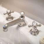 Sink with silver faucets and soap