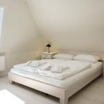 Bedroom with double bed, two nightstands, and window