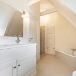 Bathroom with shower, bathtub, and mirror