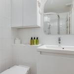 Bathroom with sink, mirror, and shower