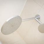 Duschkopf mit Duschbrause und Armatur an Wand