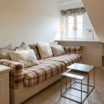 Living room with sofa, table, and window