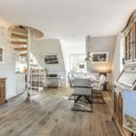 House with dining area, staircase, and hardwood floor