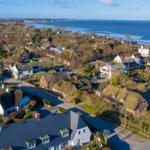 Village with traditional houses and view of the sea
