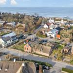 Village with thatched houses and sea view
