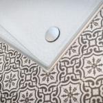 Shower tray with mosaic tiles in bathroom