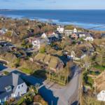 Village with thatched houses by the sea