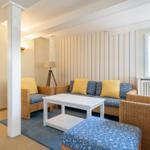 Living room with seating group, table, and window
