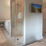 Bathroom with shower, sink and mirror cabinet