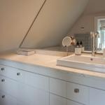 Bathroom with sink, mirror, and window