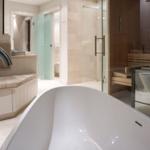 Bathroom with freestanding tub, shower, and sauna.