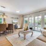 Living and dining area with view of terrace and garden.