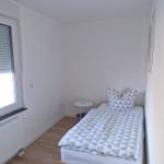 Schlafzimmer 2 mit einem Einzelbett...