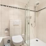 Bathroom with shower, toilet, and bathtub.
