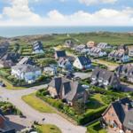 Village with houses and view of the sea