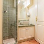Bathroom with shower, sink and mirror