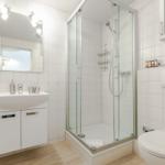 Bathroom with shower, sink, and toilet.