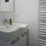 Sink with mirror, towel, and soap dispenser