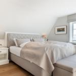 Bedroom with bed, nightstands, and window