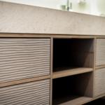 Modern cabinet with wavy fronts and open shelves.