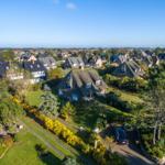 House with thatched roof and garden in quiet residential area