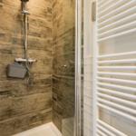 Shower with wood-effect tiles and heater