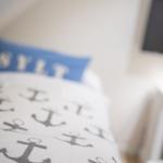 Bedroom with bed, pillow, and nightstand