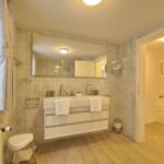 Bathroom with sink, mirror, and shower