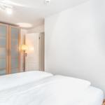 Bedroom with bed, wardrobe, and wall picture