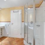 Bath with shower, sink and toilet