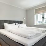 Bedroom with double bed, window and nightstand