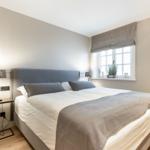 Bedroom with bed, nightstand, and window