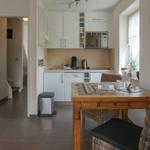 Kitchen with dining table, microwave, and dishwasher.